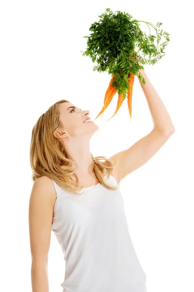 Young woman with the carrots Stock Photo