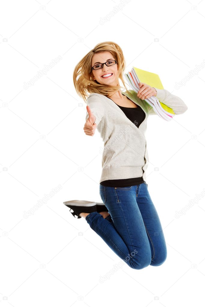 Young casual woman, student jumping.