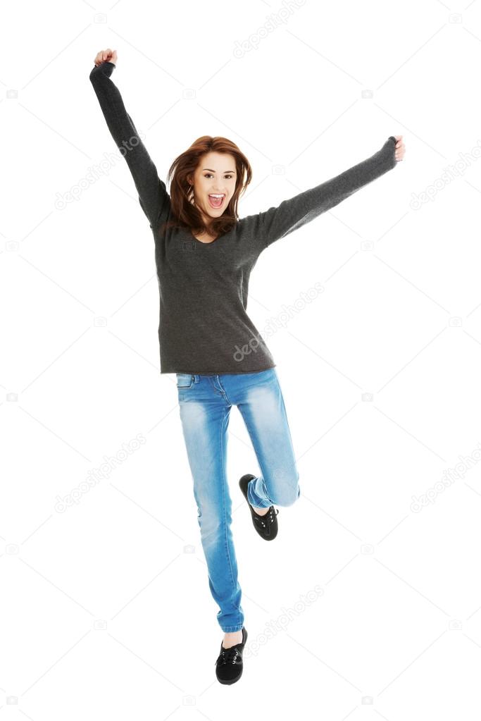 Young casual woman, student jumping.