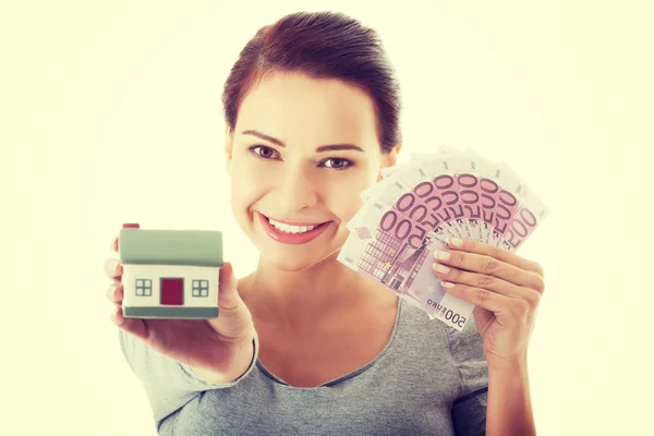 Young woman with money and house. — Stock Photo, Image