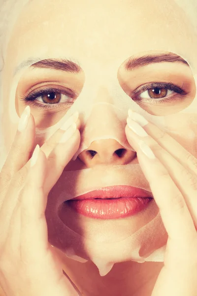 Young beautiful woman with collagen eye mask. — Stock Photo, Image