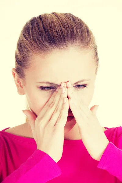 Young caucassian woman is having sinus pressure. — Stock Photo, Image