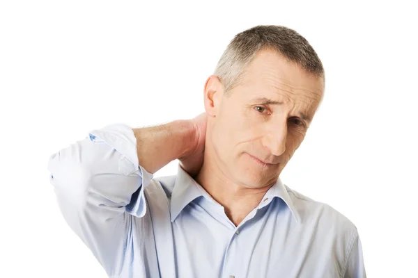 Зрелый мужчина с болью в шее — стоковое фото