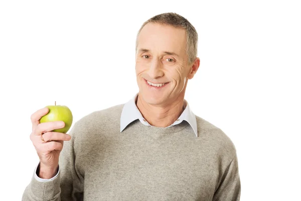 Dojrzały człowiek z jabłkiem — Zdjęcie stockowe