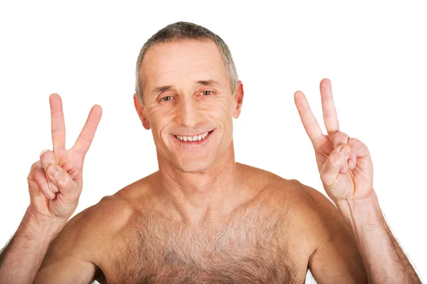 Mature shirtless man with victory sign — Stock Photo, Image