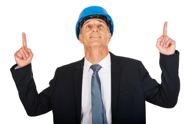 Businessman engineer pointing up — Stock Photo, Image