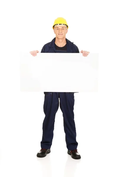 Worker presenting empty banner — Stock Photo, Image