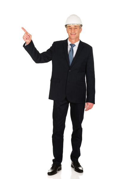 Businessman pointing up