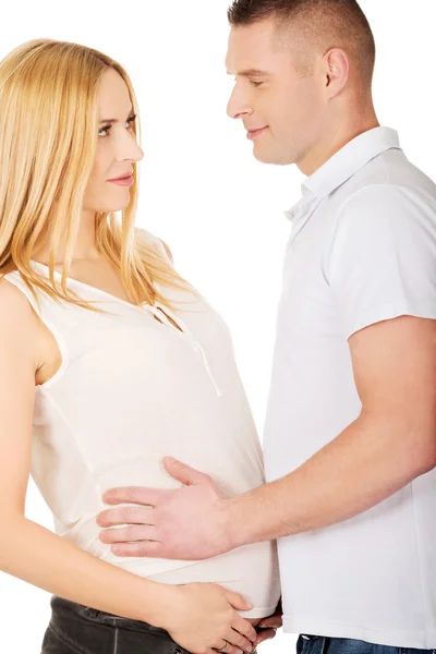 Otec dotýká jeho těhotná manželka břicho — Stock fotografie
