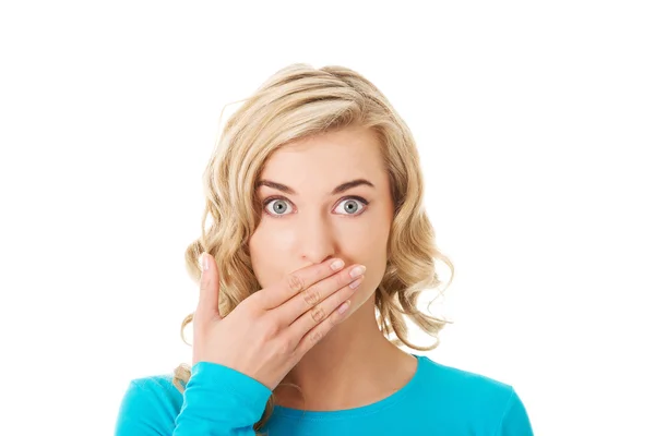 Woman covering her mouth Royalty Free Stock Images