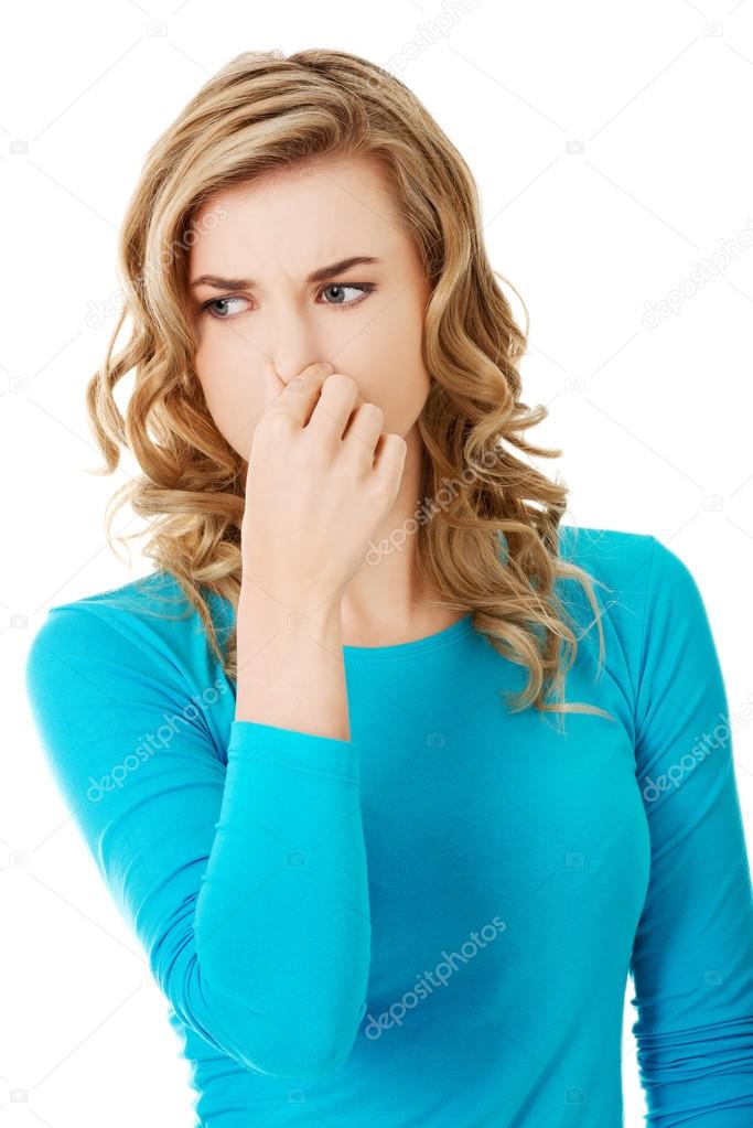 Woman clogging nose