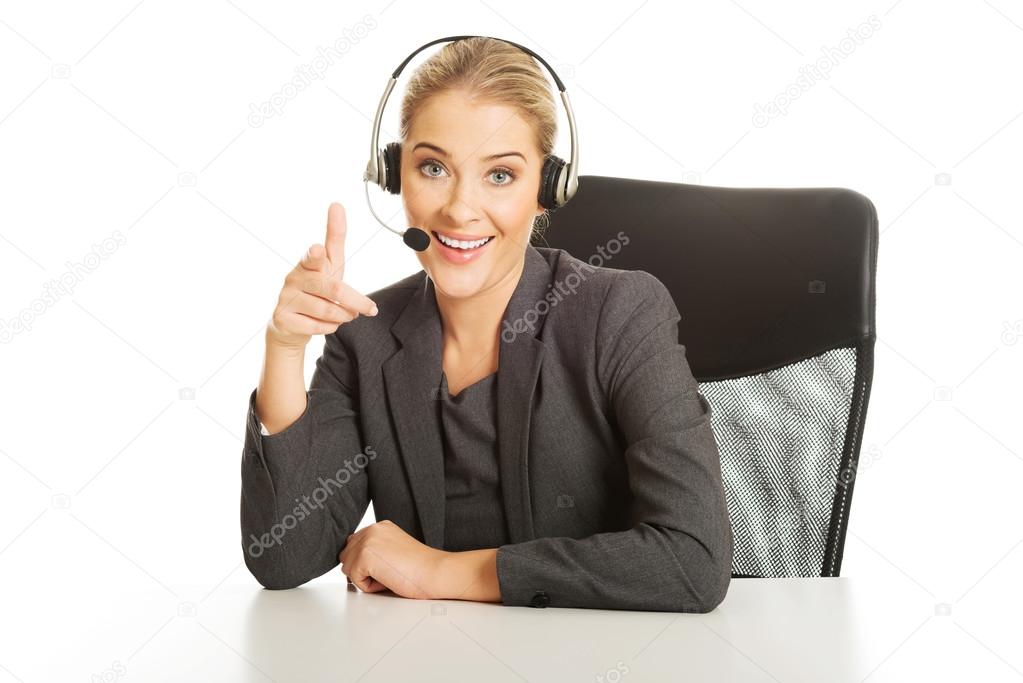 Call center woman sitting at the desk