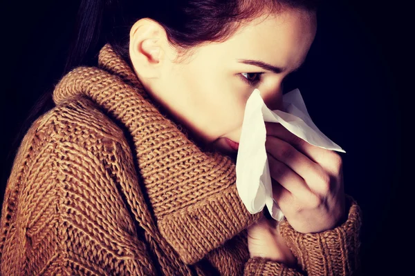 Young beautiful woman with tissue. — Stock Photo, Image