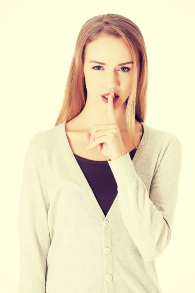 Bella donna con un dito sulle labbra . — Foto Stock