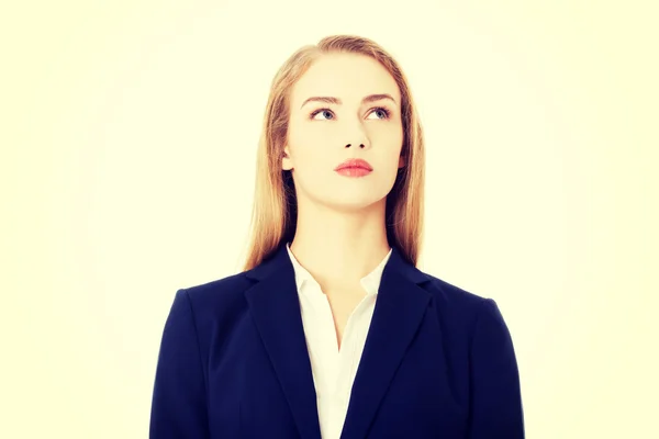 Beautiful business woman looking up at copy space. — Stock Photo, Image