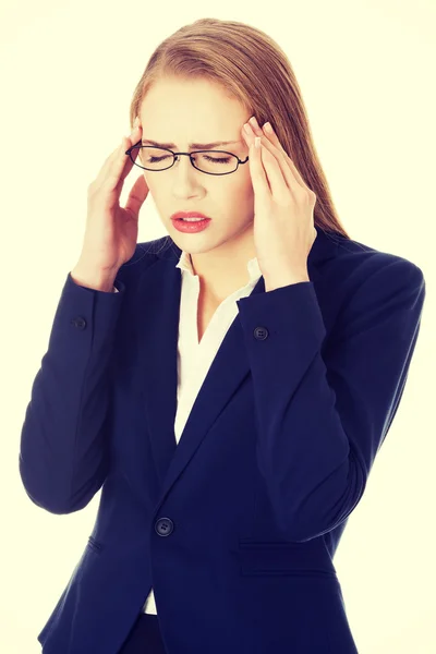 Business woman is having a headache. — Stock Photo, Image