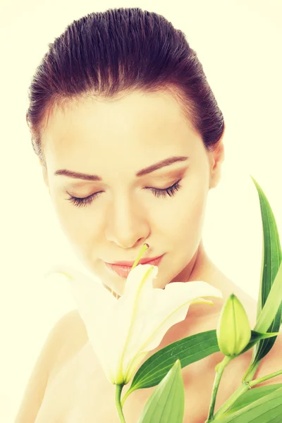 Beautiful topless woman with white lily. — Stock Photo, Image