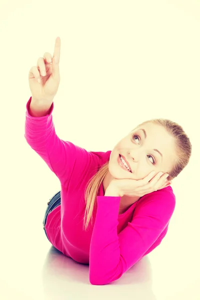 Young beautiful casual woman pointing up. — Stock Photo, Image