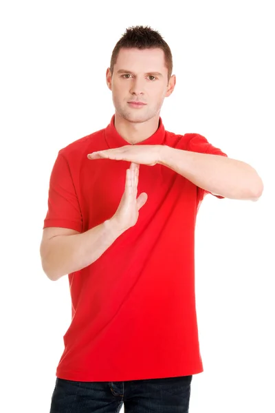 Handsome man showing time out sign — Stock Photo, Image