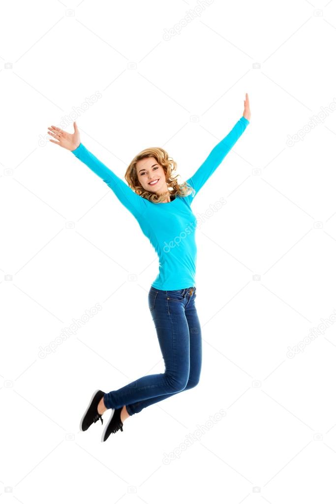 Young casual woman, student jumping.