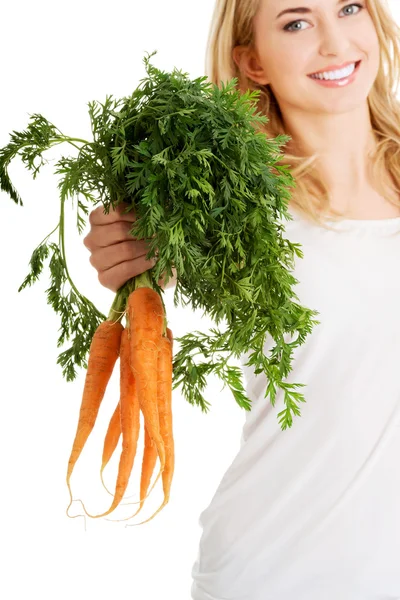 Young woman with the carrots — Stock Photo, Image