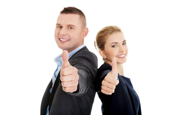 Business couple showing thumbs up — Stock Photo, Image