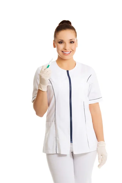 Female dentist holding a syringe — Stock Photo, Image