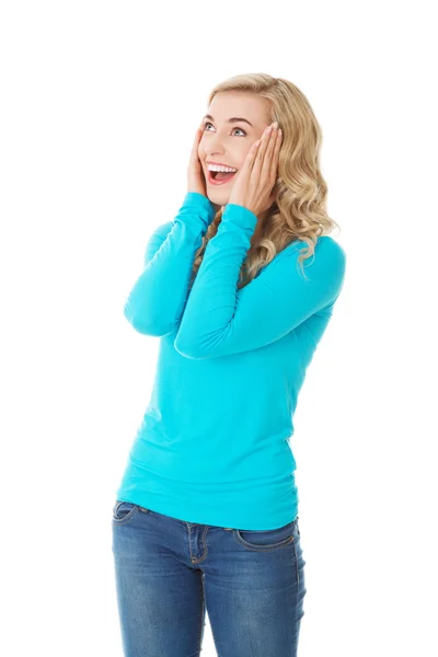 Surprised woman with hands on head — Stock Photo, Image