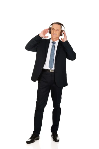 Businessman with big headphones — Stock Photo, Image