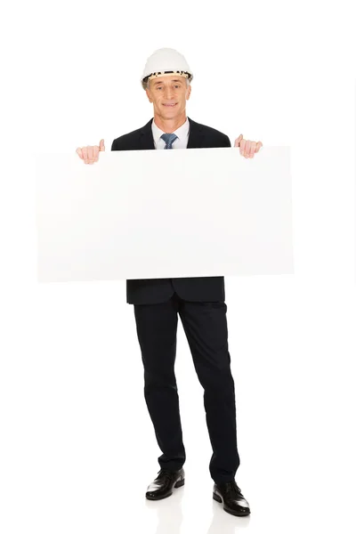 Businessman holding empty banner — Stock Photo, Image