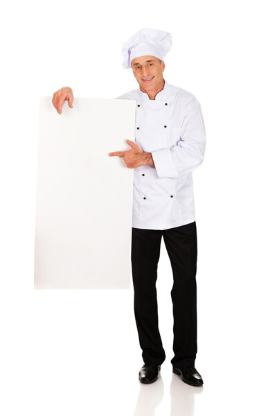 Chef in white uniform holding empty banner