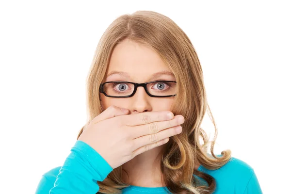 Teenager covering her mouth — Stock Photo, Image