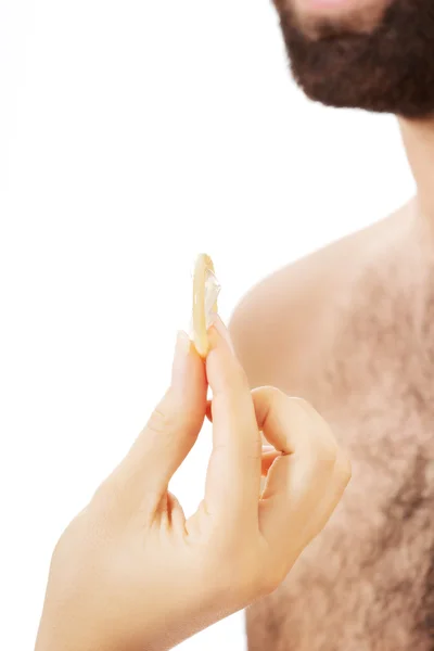 Couple with a condom. — Stock Photo, Image