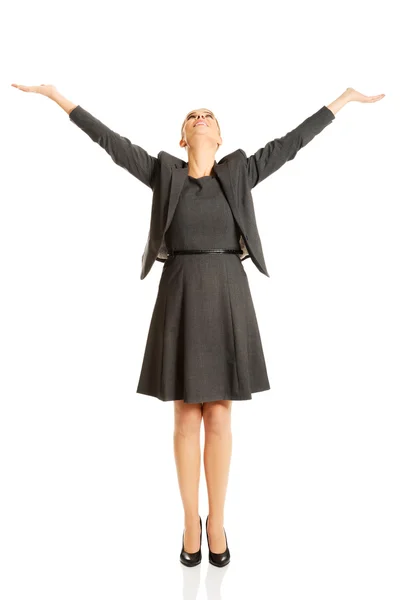 Businesswoman raising arms high — Stock Photo, Image