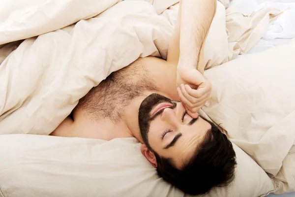 Man waking up in bedroom. — Stock Photo, Image