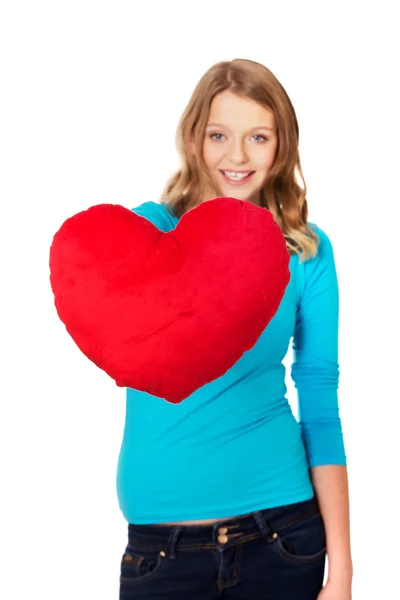 Mujer con almohada en forma de corazón Imagen De Stock