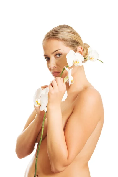 Woman with an orchid flower — Stock Photo, Image