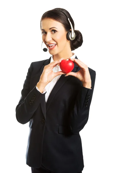 Call center woman holding heart model — Stock Photo, Image
