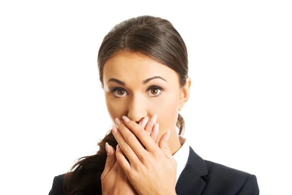 Businesswoman covering mouth Stock Picture