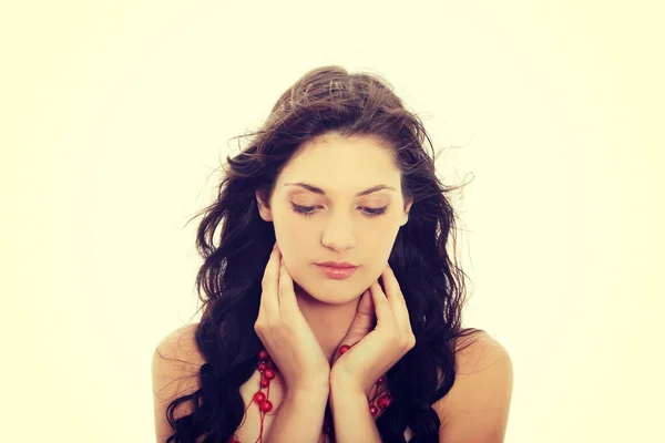 Brunette woman with red necklace. — Stock Photo, Image