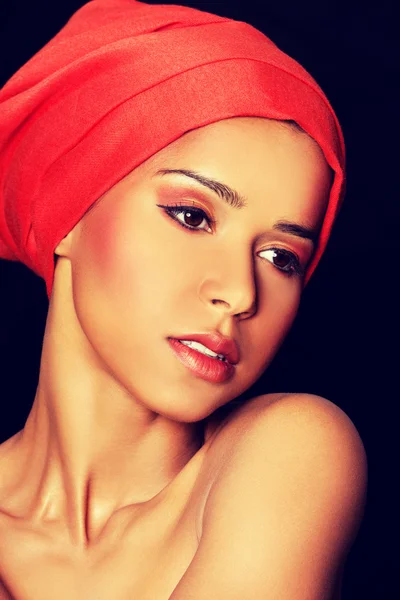 Attractive womans head in turban. — Stock Photo, Image