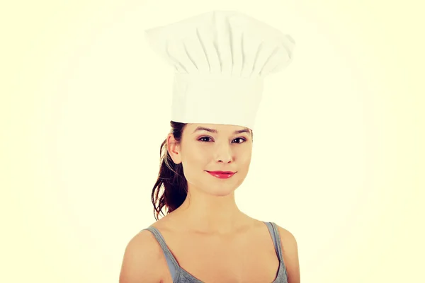 Młoda kobieta z kapelusz kucharz. — Zdjęcie stockowe