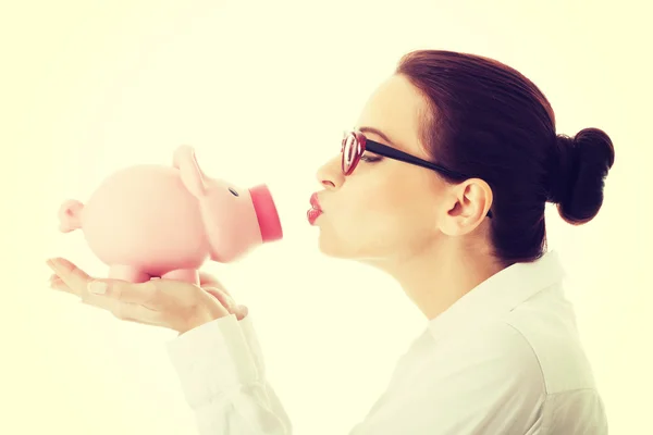 Beautiful business woman holding piggy-bank. — Stock Photo, Image