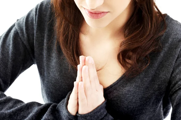 Woman praying with her hands together — Stock Photo, Image