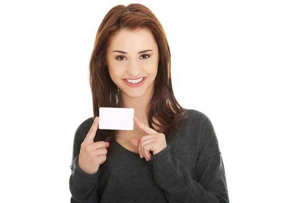 Casual happy woman with business card — Stock Photo, Image