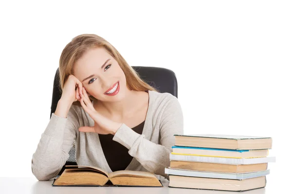 Woman sitting with stack of books — Stock Photo, Image