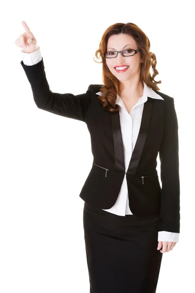 Mujer de negocios señalando hacia arriba . — Foto de Stock