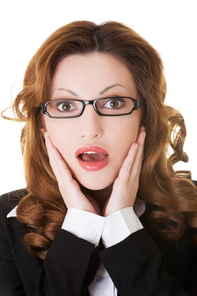 Surprised businesswoman holding her head. — Stock Photo, Image