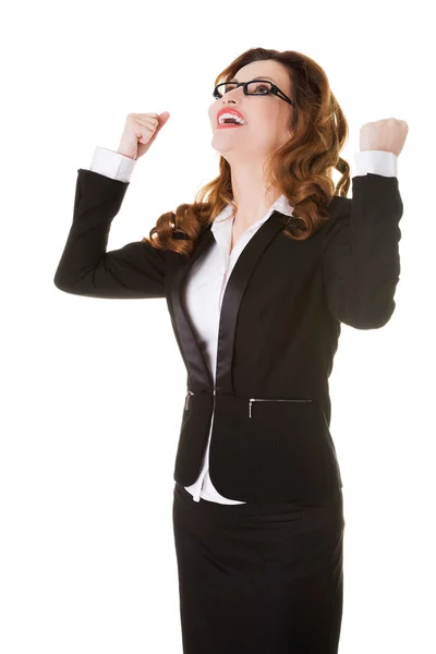 Businesswoman in a winner gesture. — Stock Photo, Image