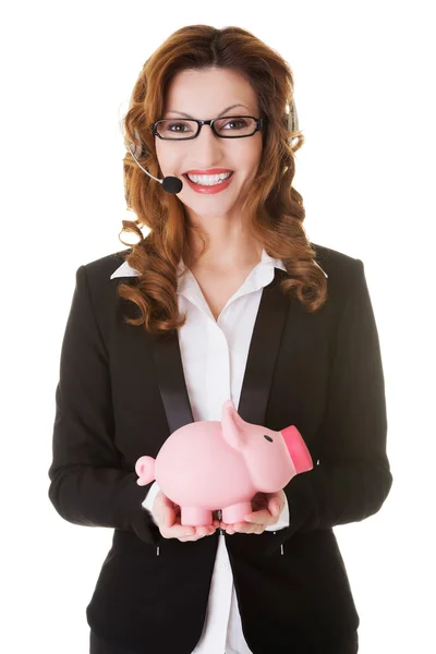 Call center vrouw met piggy bank. — Stockfoto